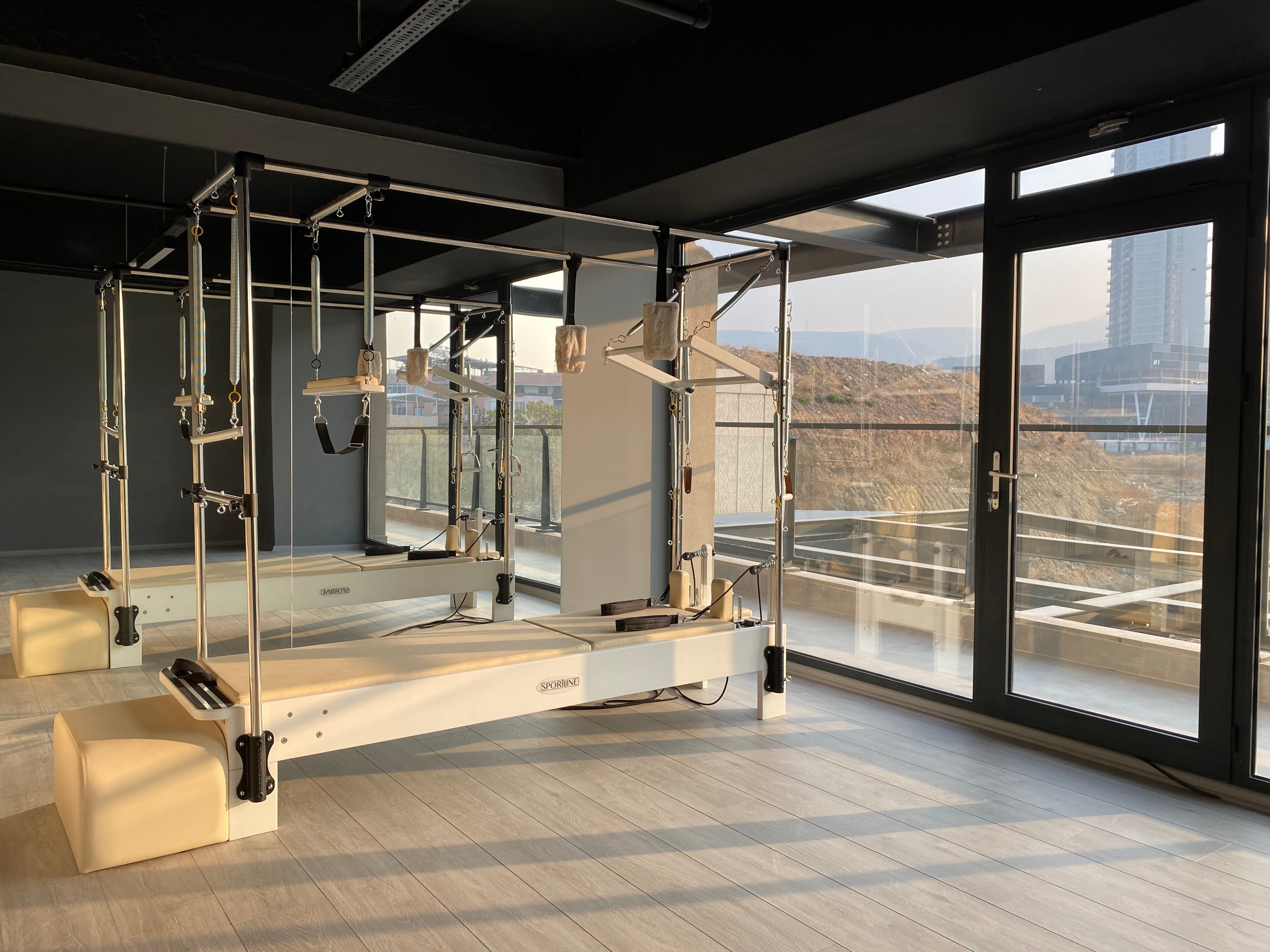 Discover the Benefits of Pilates Cadillac Reformer Trapeze